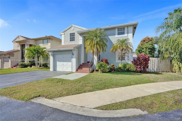 view of front facade with a garage and a front yard