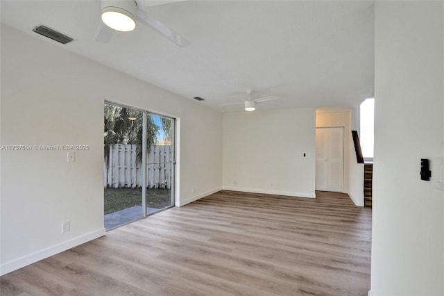 empty room featuring light hardwood / wood-style floors and ceiling fan