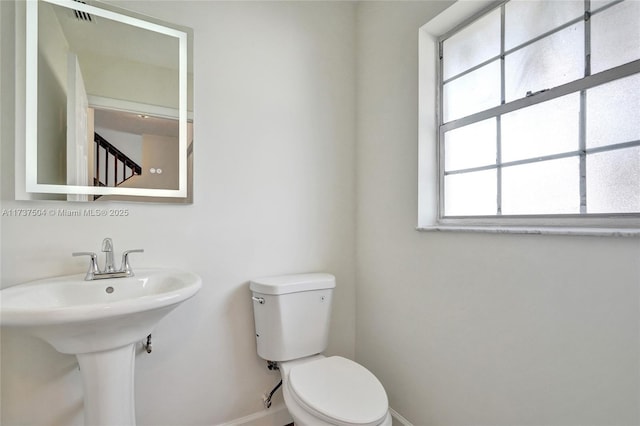 bathroom with sink and toilet