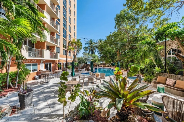 view of property's community with a patio and a swimming pool