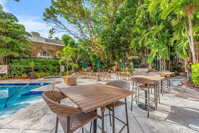 view of swimming pool with a patio