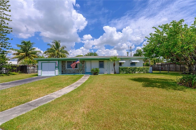 ranch-style house with a garage and a front yard