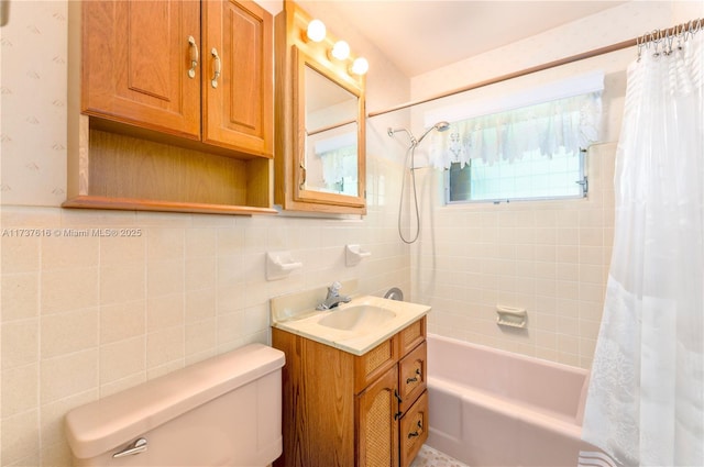 full bathroom featuring vanity, tile walls, shower / bathtub combination with curtain, and toilet