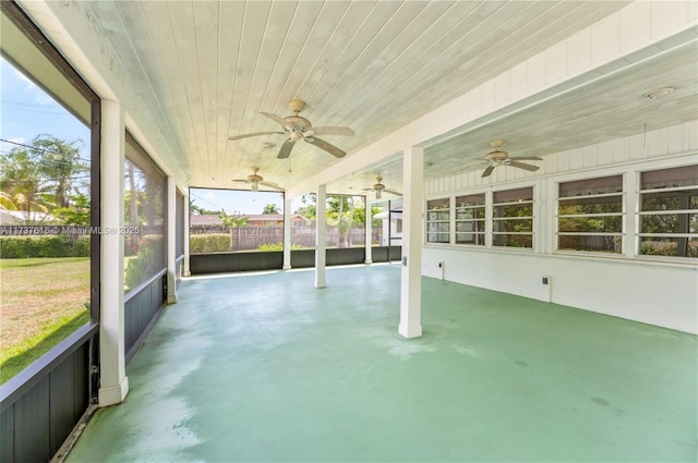 unfurnished sunroom with wooden ceiling