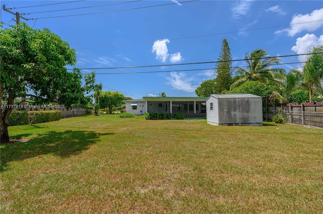 view of yard featuring a storage unit