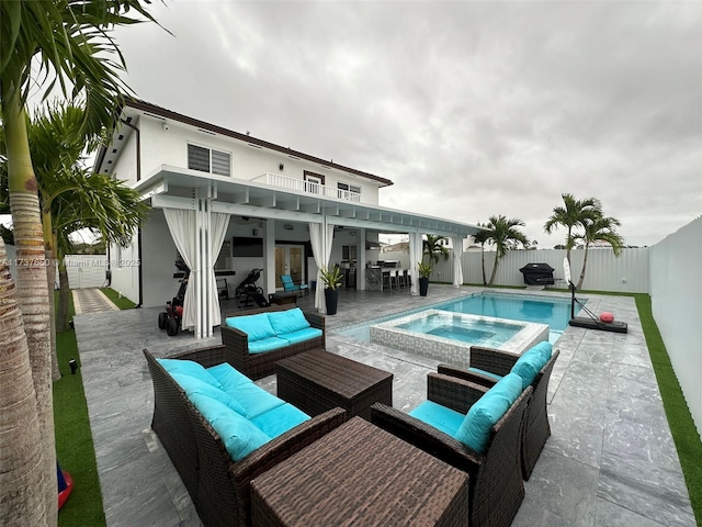 10290 SW 7th Ter, Sweetwater, FL 33174 - view of pool with grilling area, an outdoor living space, a pool with connected hot tub, a fenced backyard, and a patio area