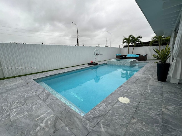 10290 SW 7th Ter, Sweetwater, FL 33174 - view of pool featuring a patio area, a fenced backyard, and a pool with connected hot tub