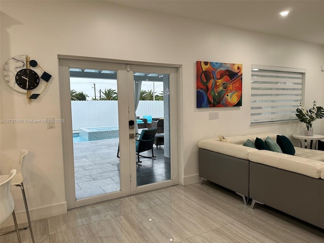 10290 SW 7th Ter, Sweetwater, FL 33174 - living room with french doors and baseboards
