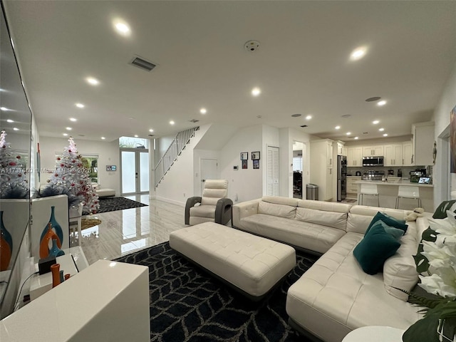 10290 SW 7th Ter, Sweetwater, FL 33174 - living room with visible vents, recessed lighting, and stairs
