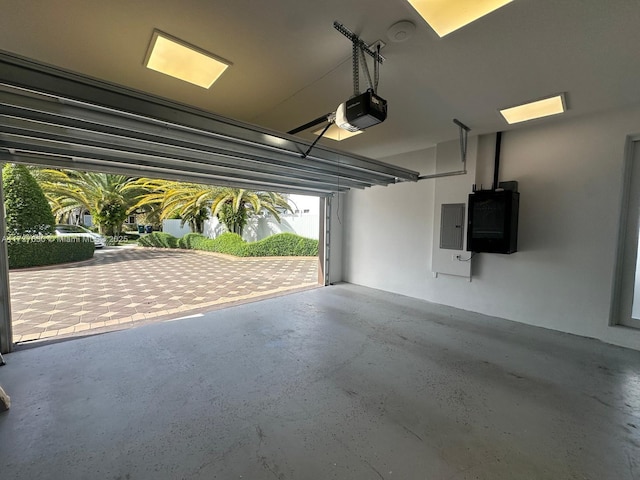 10290 SW 7th Ter, Sweetwater, FL 33174 - garage featuring a garage door opener and electric panel