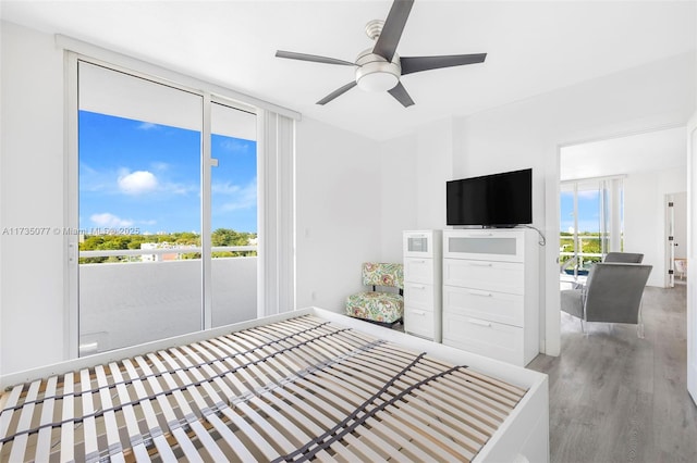 bedroom featuring hardwood / wood-style floors and ceiling fan