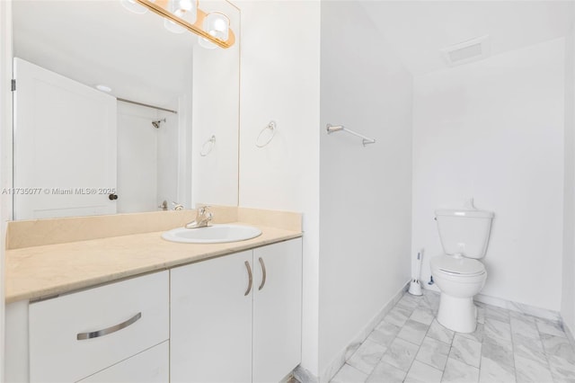 bathroom with vanity and toilet