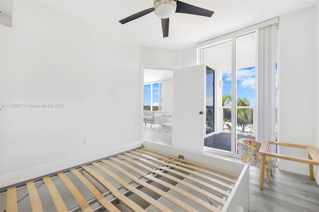 unfurnished room featuring ceiling fan and light hardwood / wood-style flooring