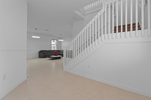 staircase with tile patterned floors