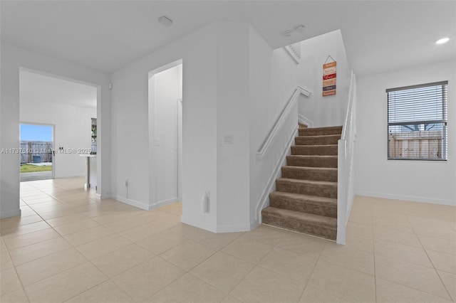 staircase with tile patterned flooring