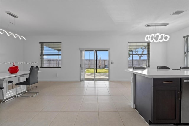 kitchen featuring pendant lighting and light tile patterned flooring