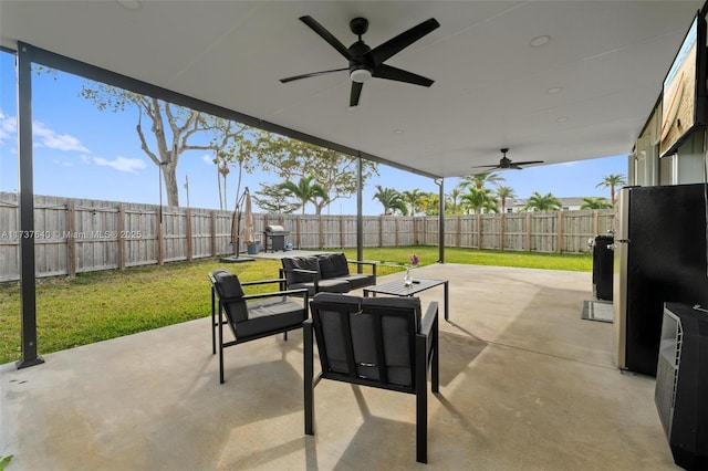 view of patio / terrace featuring ceiling fan