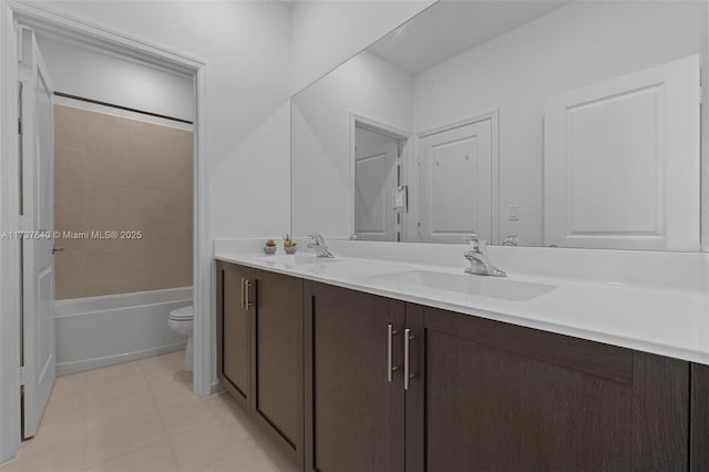 full bathroom with vanity, toilet, tiled shower / bath combo, and tile patterned flooring