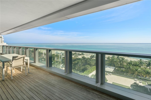 deck featuring a water view and a beach view