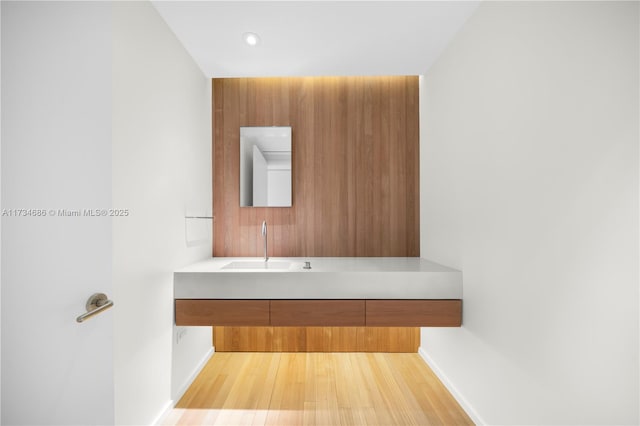 bathroom featuring vanity and wood-type flooring