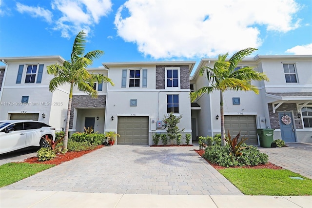 multi unit property featuring a garage