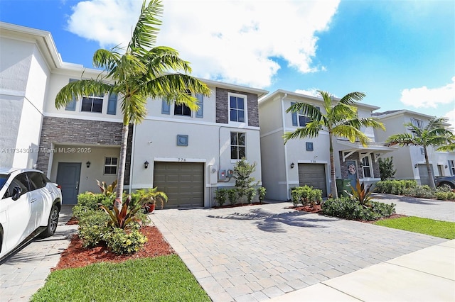 townhome / multi-family property featuring a garage