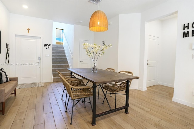 dining area with light wood-type flooring