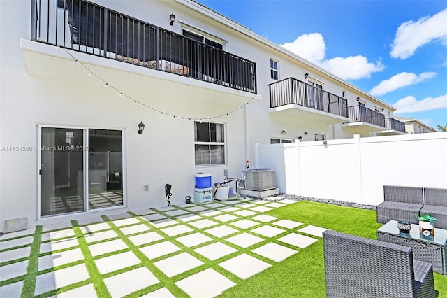 rear view of house featuring a patio, an outdoor hangout area, and cooling unit