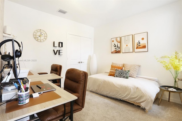 bedroom with carpet floors and a closet