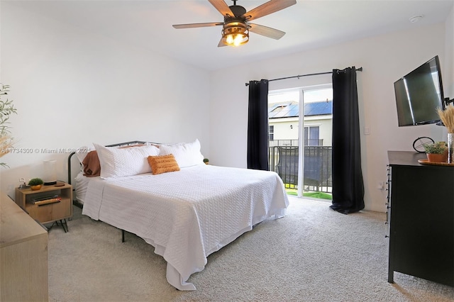 carpeted bedroom featuring ceiling fan and access to outside