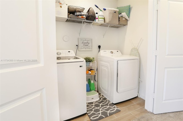 washroom with washing machine and dryer