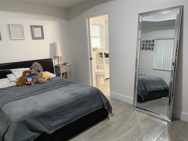 bedroom featuring connected bathroom