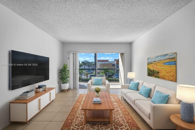 living room with light tile patterned floors and a textured ceiling