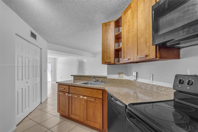 kitchen featuring light tile patterned flooring, sink, black appliances, light stone countertops, and a textured ceiling