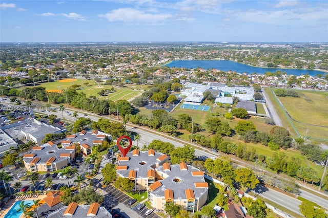 birds eye view of property with a water view