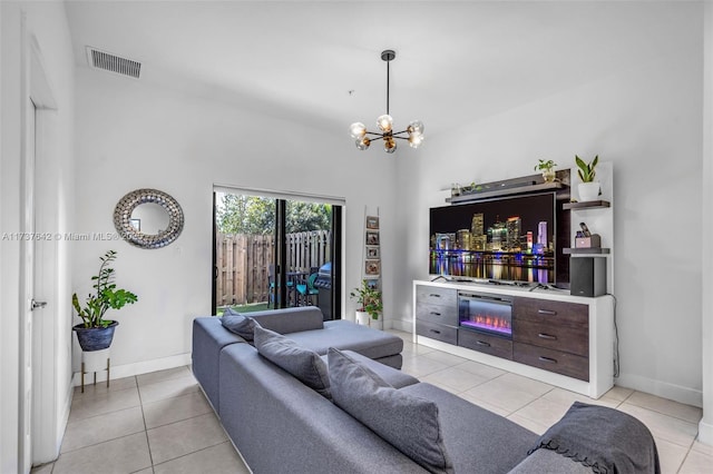 tiled living room featuring a chandelier