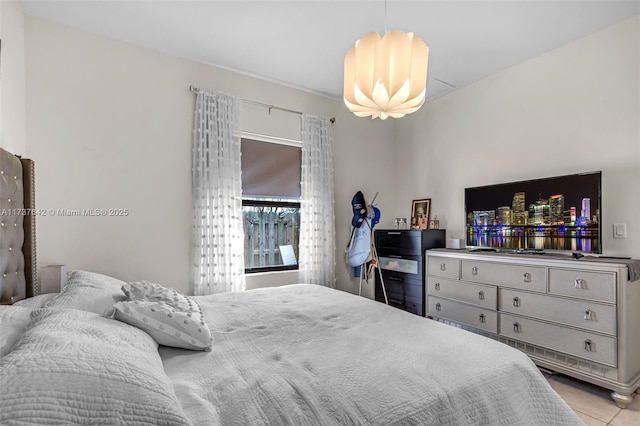 bedroom featuring an inviting chandelier