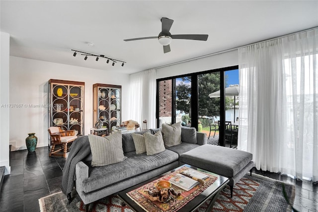 living room featuring track lighting and ceiling fan