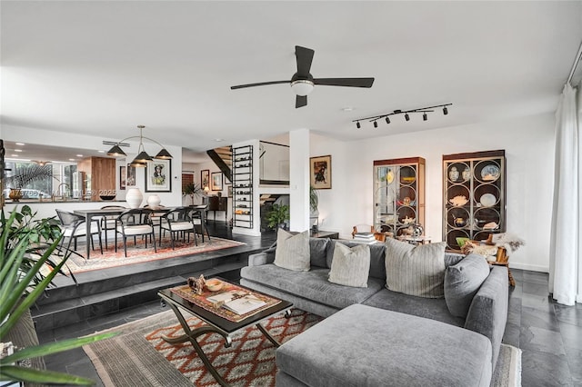 living room with ceiling fan and rail lighting