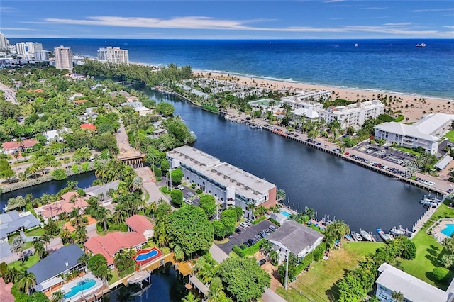 drone / aerial view with a water view and a view of the beach