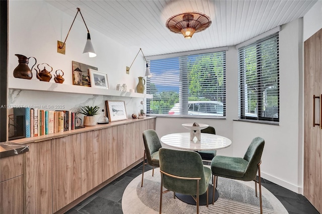 dining room with wood ceiling