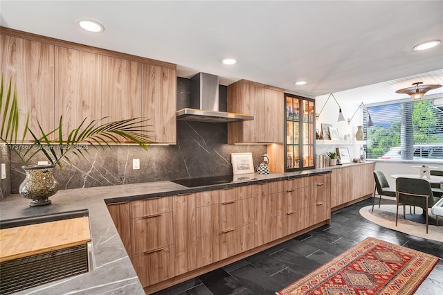 kitchen with black electric cooktop, wall chimney range hood, tasteful backsplash, and dark hardwood / wood-style floors