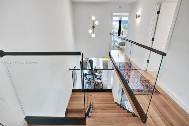 stairs with wood-type flooring