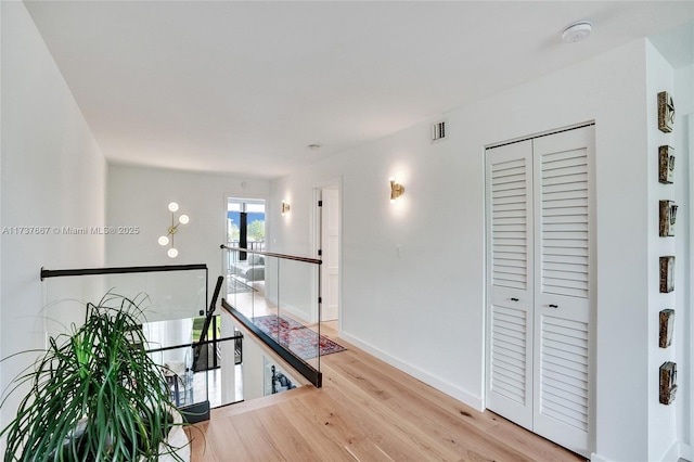 corridor with light wood-type flooring