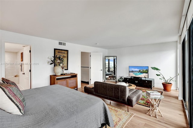 bedroom with light hardwood / wood-style flooring