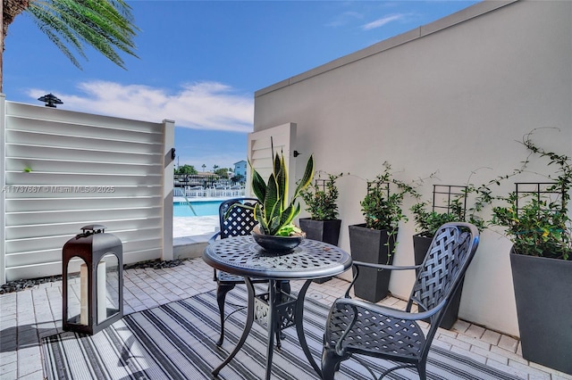 wooden deck featuring a patio area