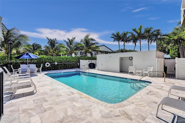 view of swimming pool featuring a patio