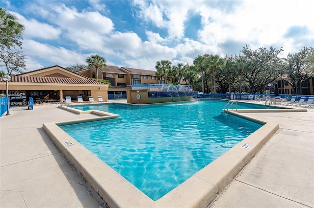 view of swimming pool featuring a patio