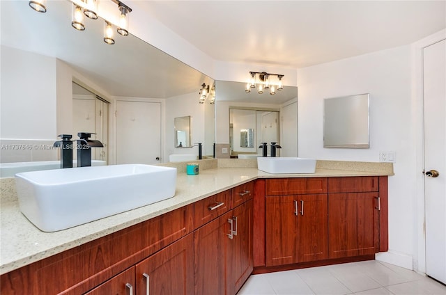 bathroom with tile patterned floors and vanity