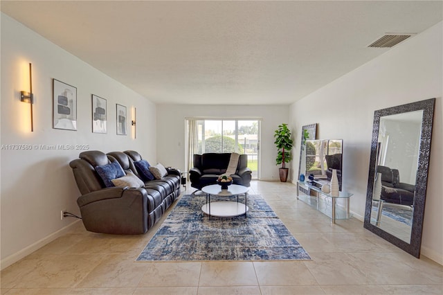 living room with a textured ceiling